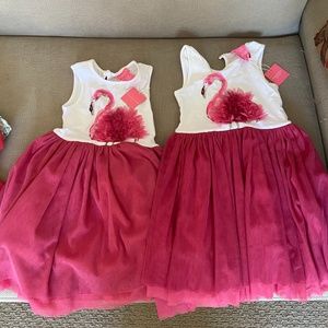 Two flamingo dresses